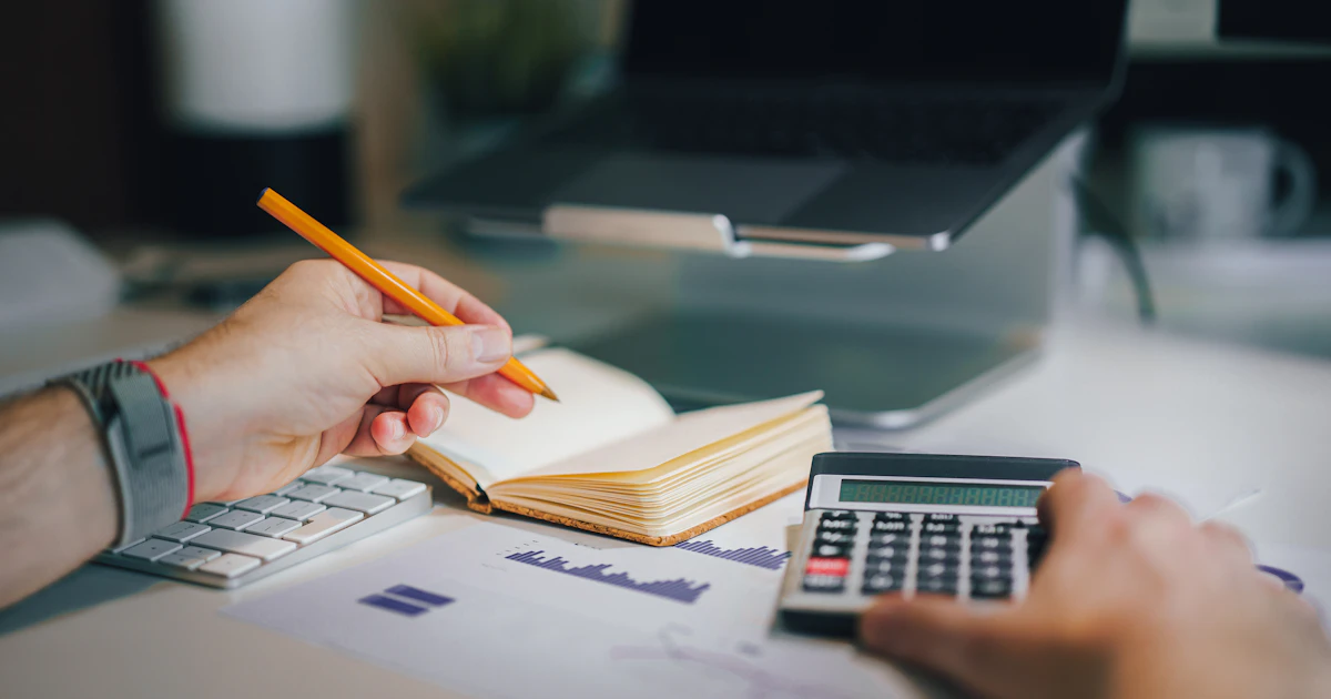 Bookkeeper professional certificates and accounting textbooks arranged on a tidy office desk